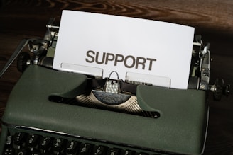 a close up of a typewriter with a paper on it