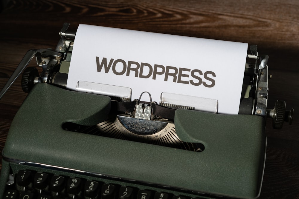 a close up of a typewriter with the word wordpress printed on it