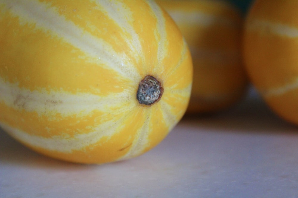 a close up of a group of oranges on a table