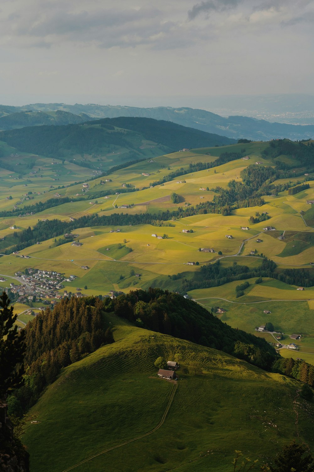 a view of a valley with a village in the distance