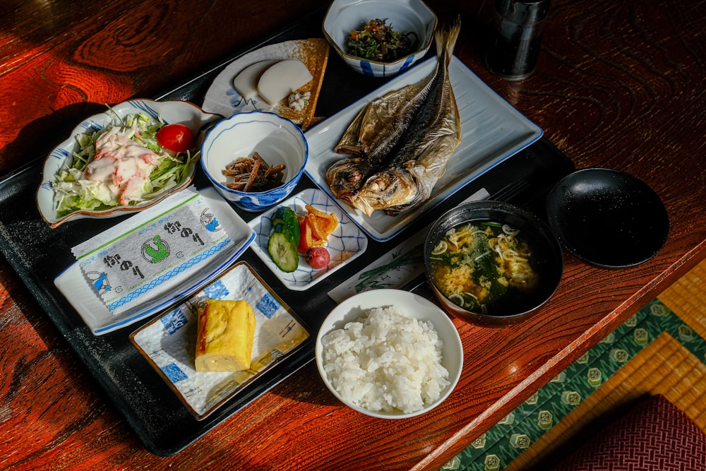 a tray of food on a wooden table