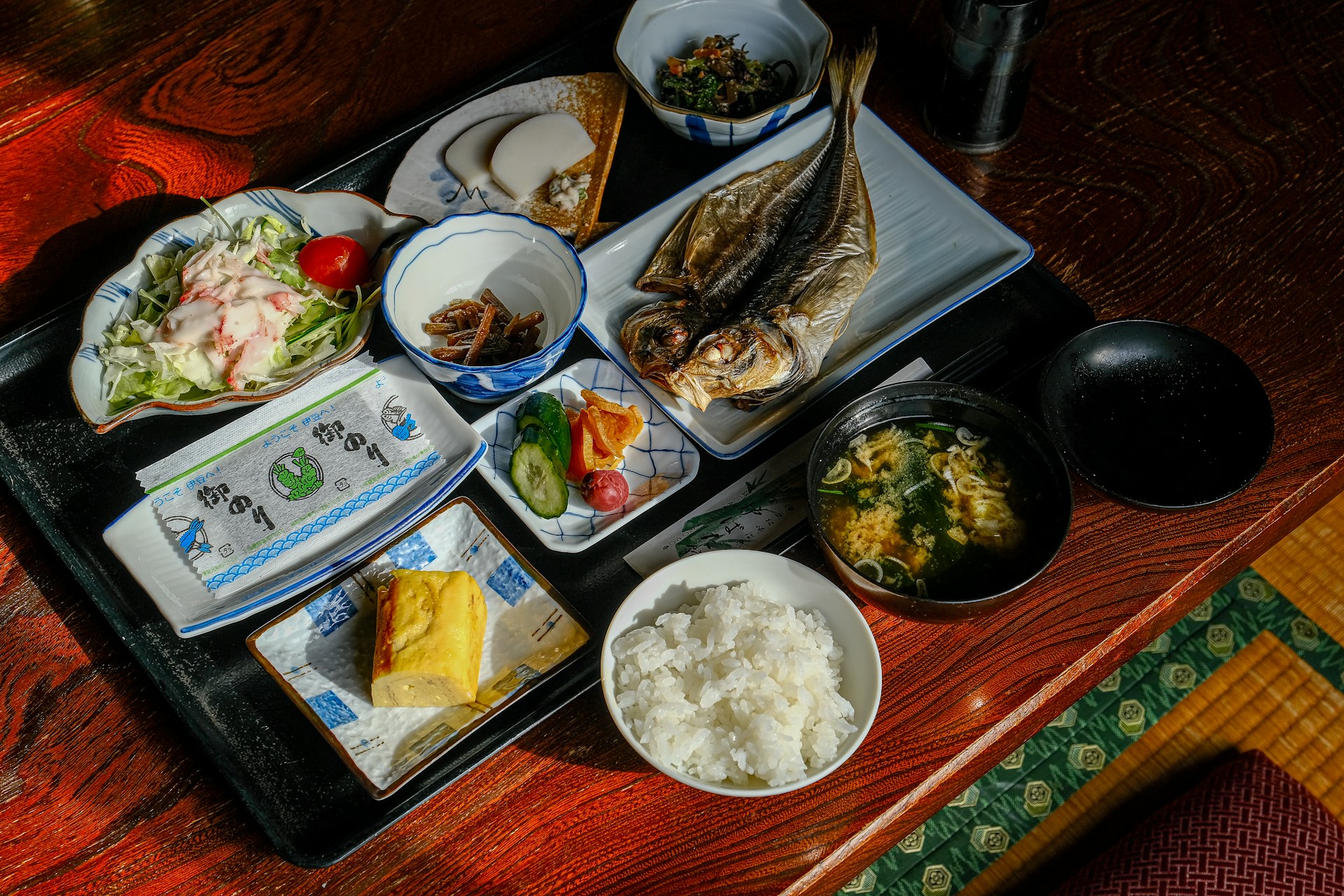 a tray of food on a wooden table