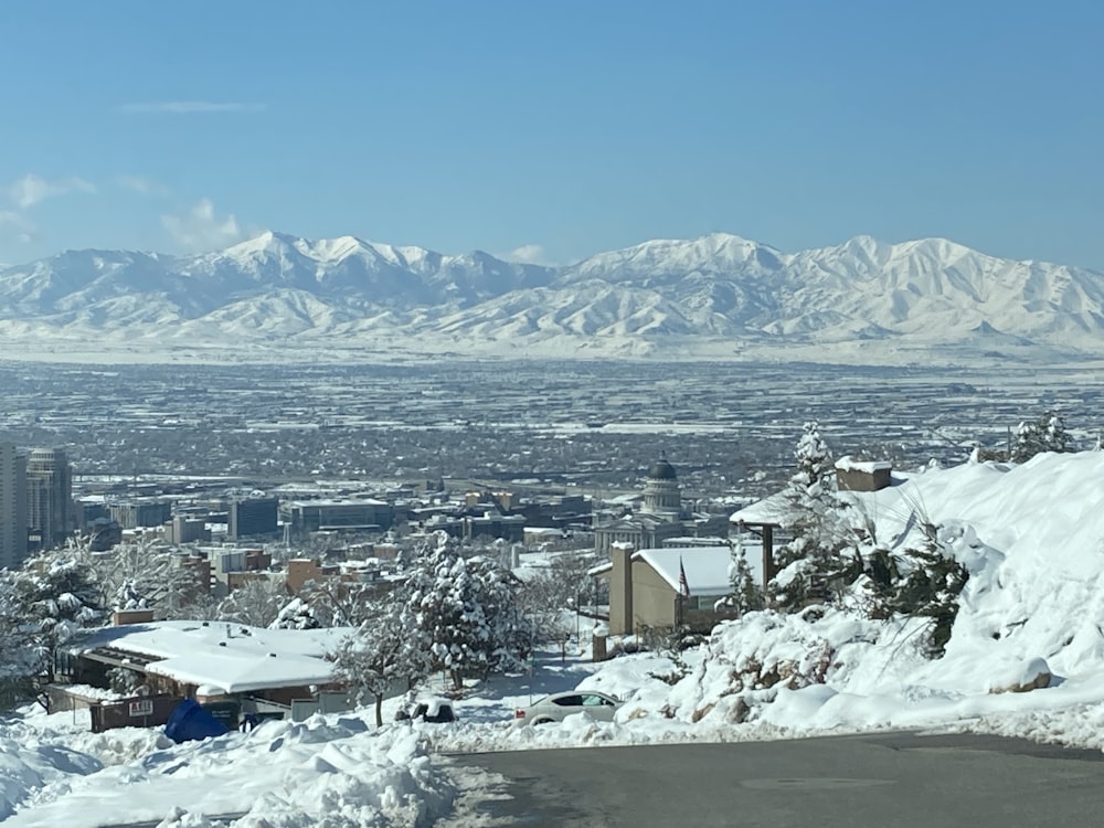 a view of a city with mountains in the background