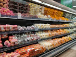 a grocery store filled with lots of fruits and vegetables