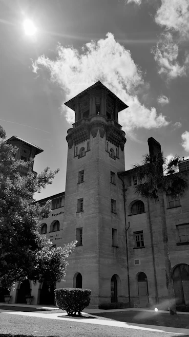 The majestic University Library of Leuven with its tall tower and intricate architecture on a sunny day