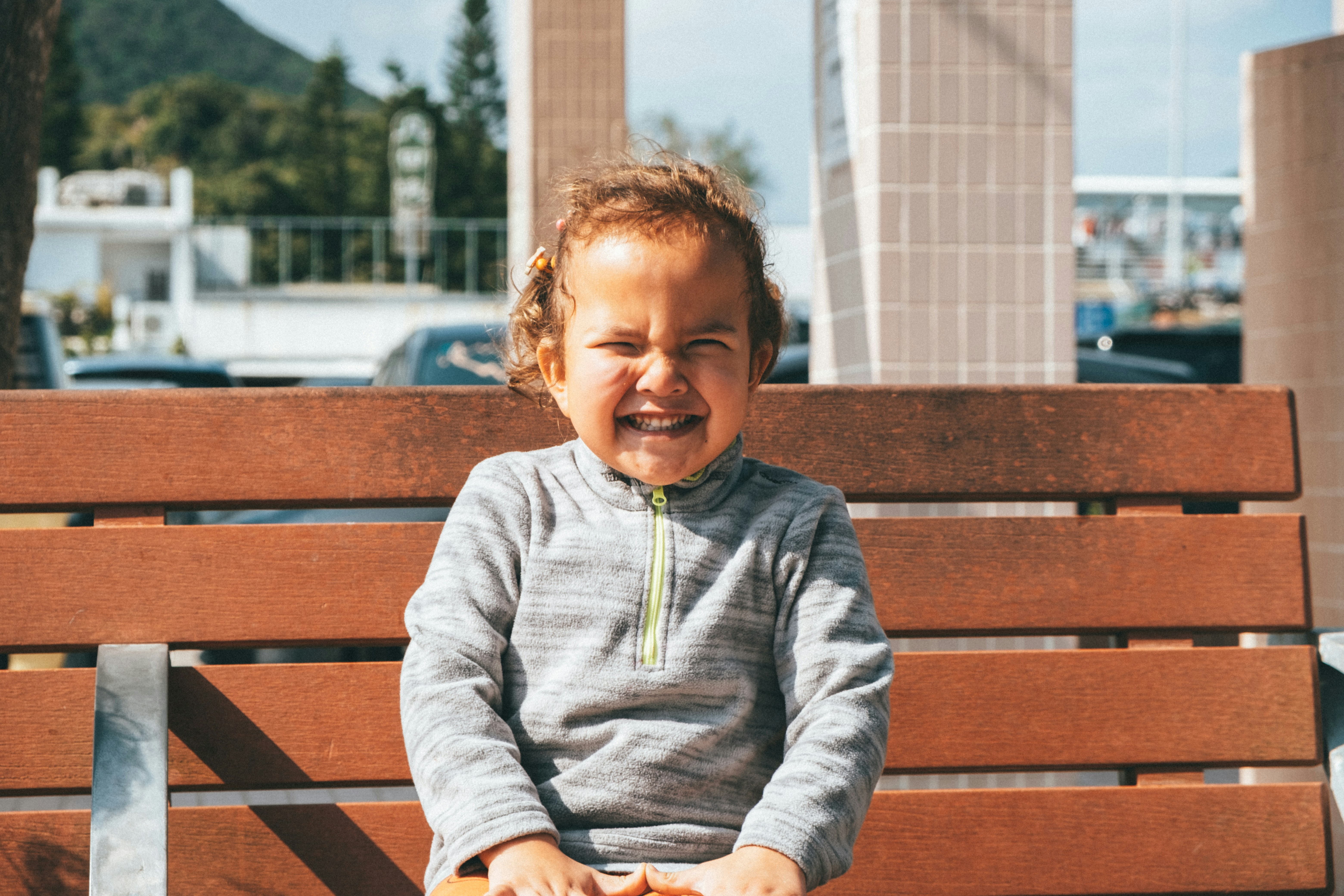 Child sitting on a bench