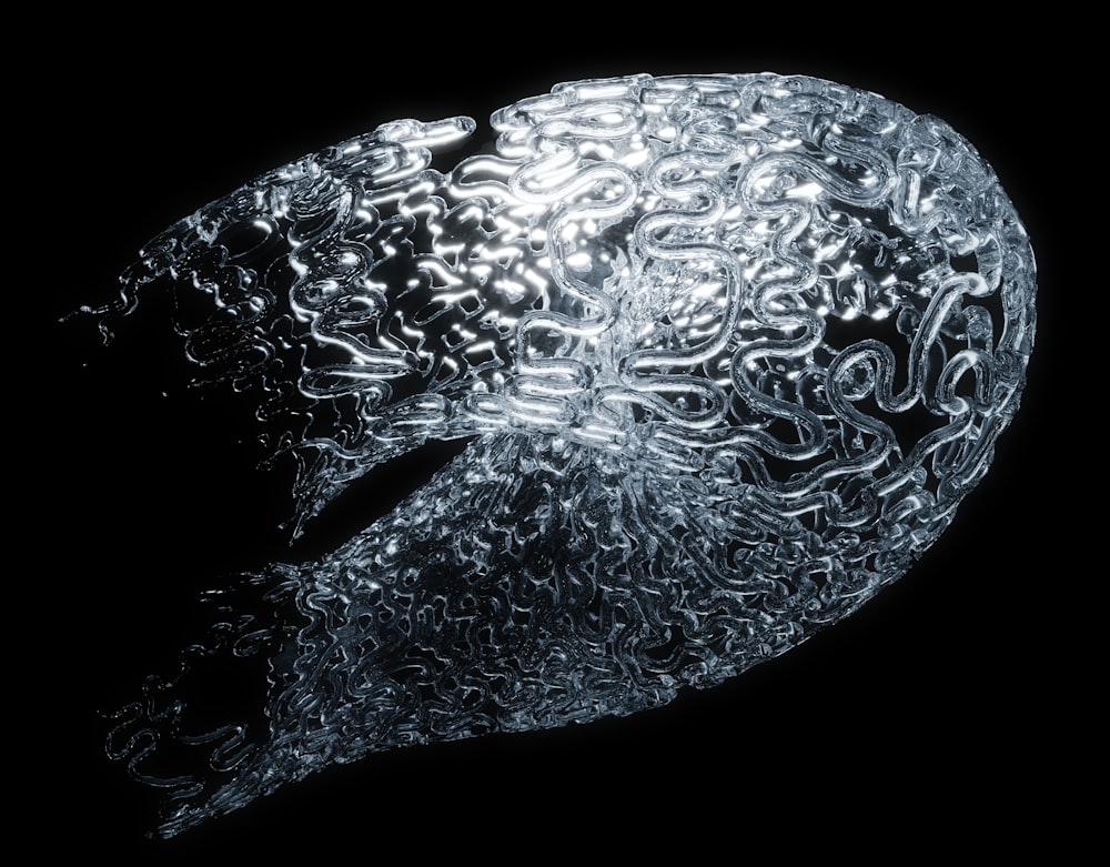 a close up of a glass object on a black background