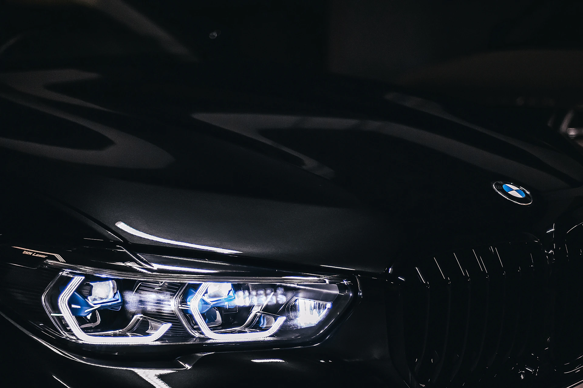 a close up of a black car in the dark