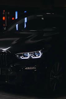 Night shot of the JK Auto Socorro truck with glassmorphism overlay effects, highlighting its polished design.