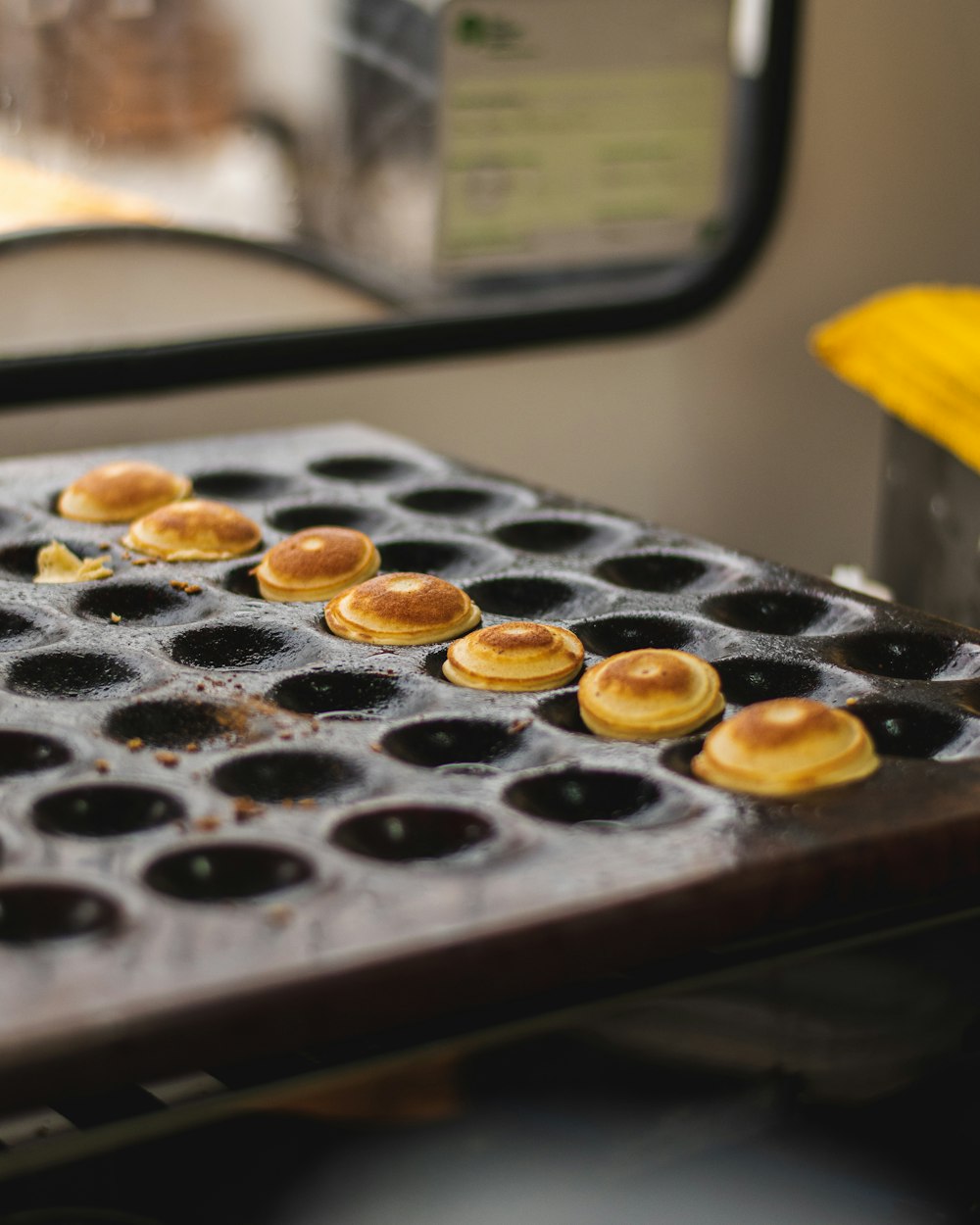 a bunch of donuts that are on a grill