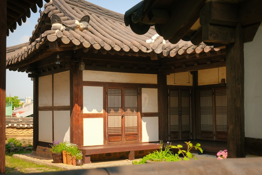 a building with a wooden bench in front of it