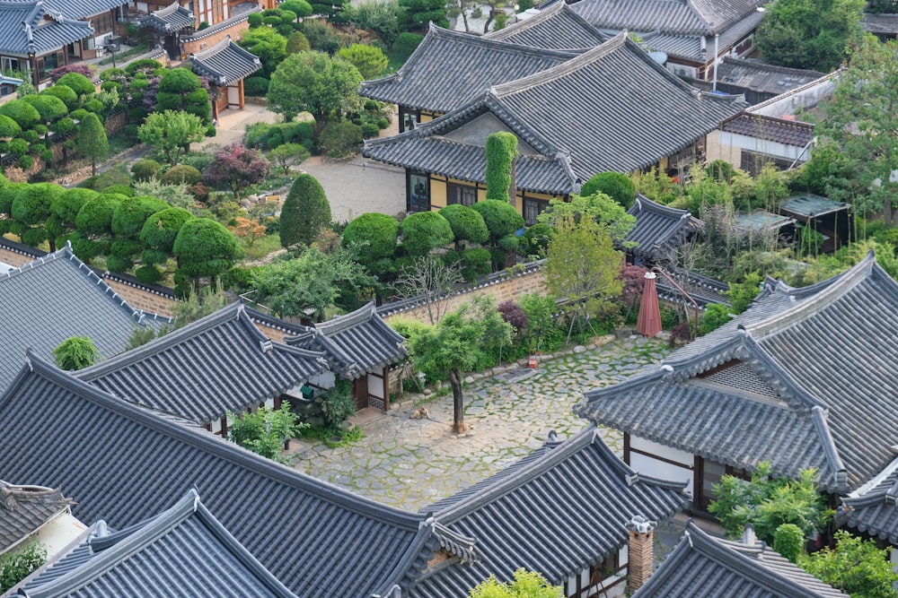 an aerial view of a building with many roofs