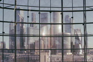Reflection of a neat cityscape on a perfectly cleaned high-rise office window.