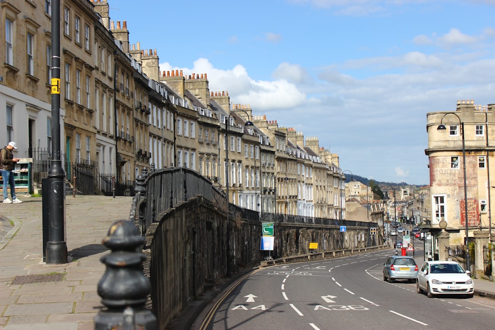 a city street with a bridge and cars on it