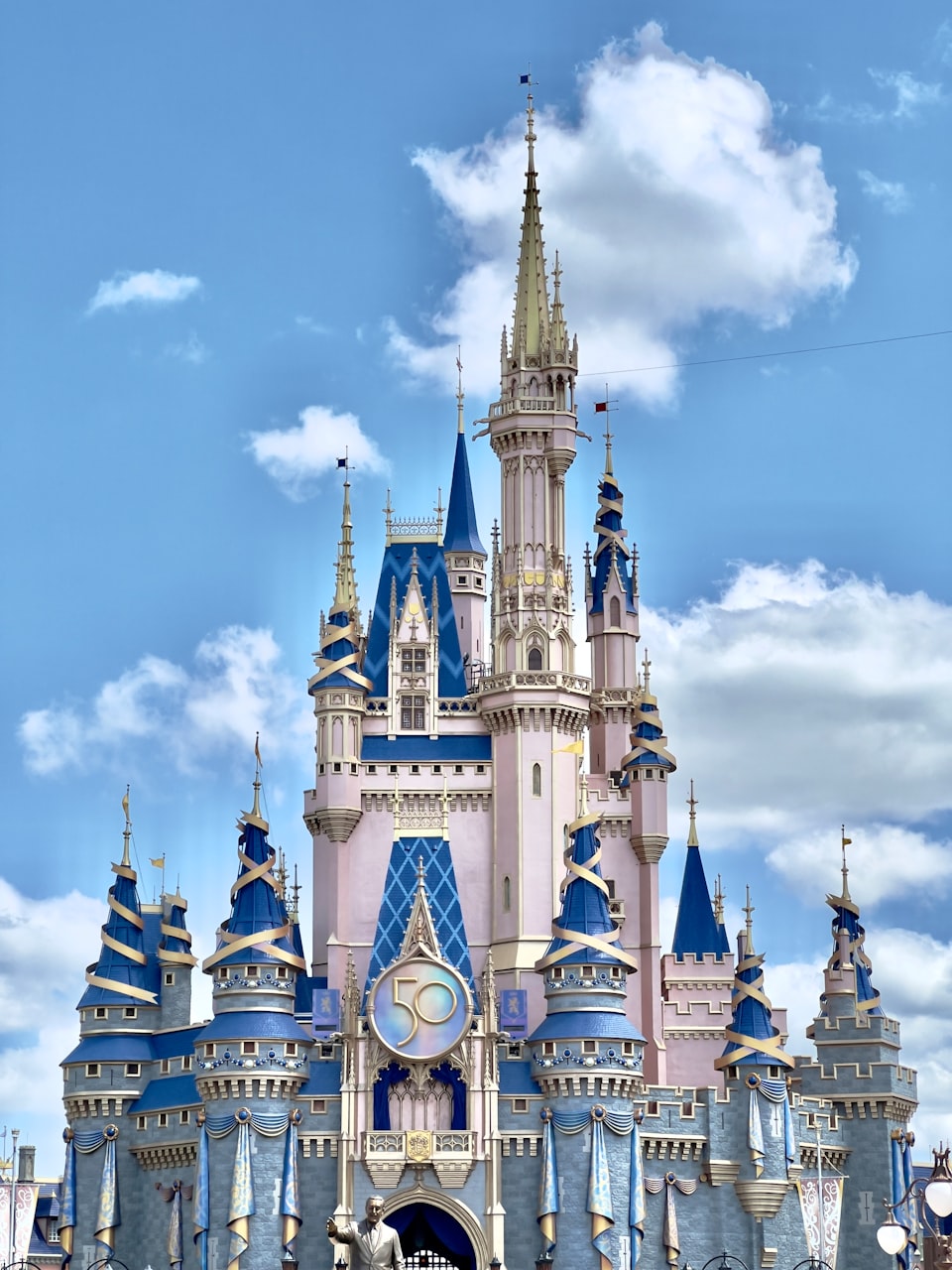 Walt Disney World Magic Kingdom castle with 50th anniversary badge.