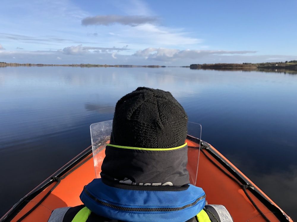 a person in a boat on a lake