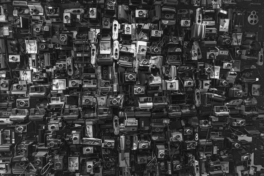a black and white photo of old cameras