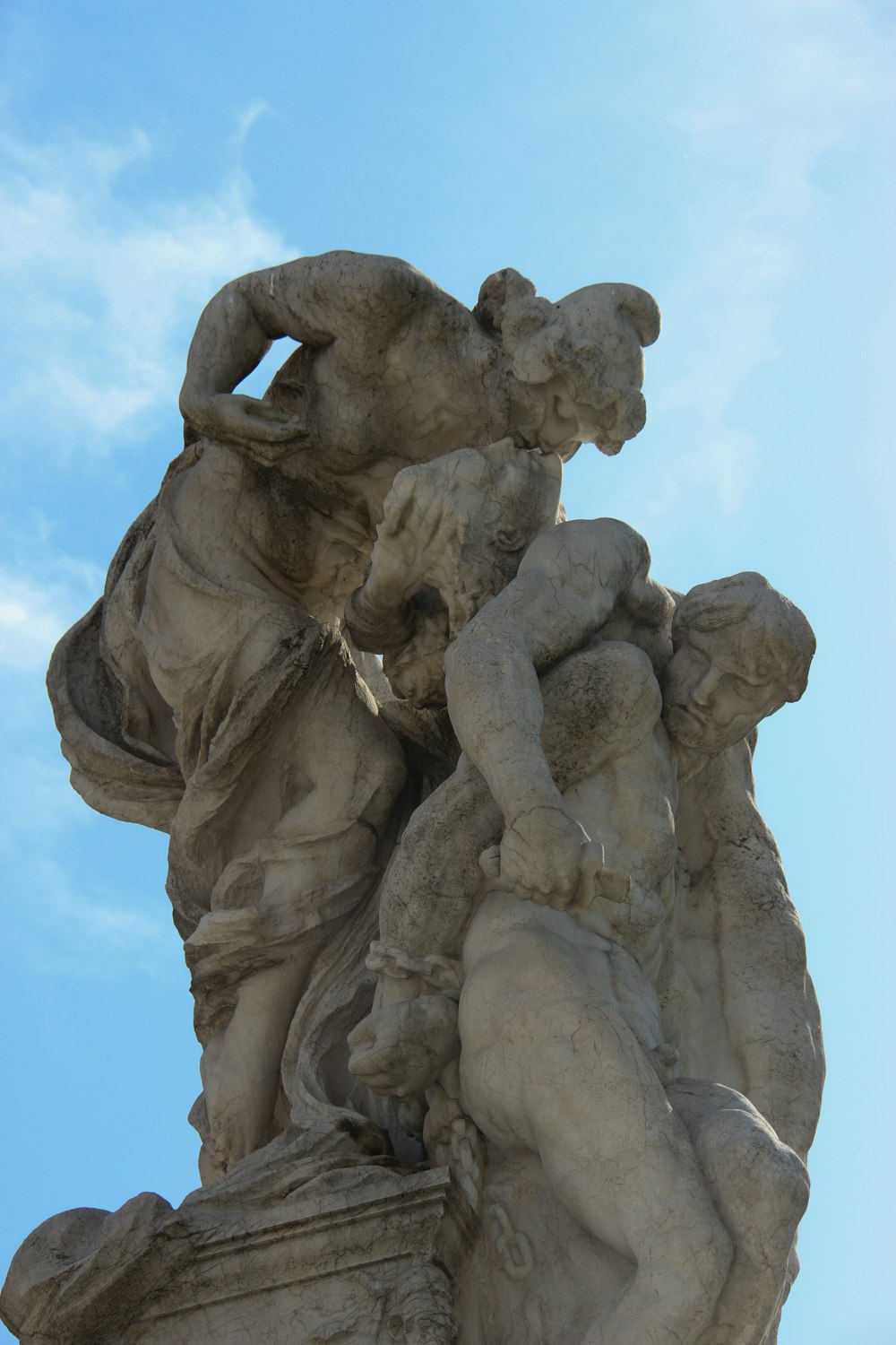 a statue of a man holding a woman