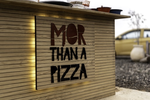 a sign that says mor than a pizza