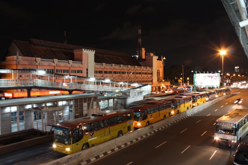 Night view of a Gontijo bus station with buses lined up
