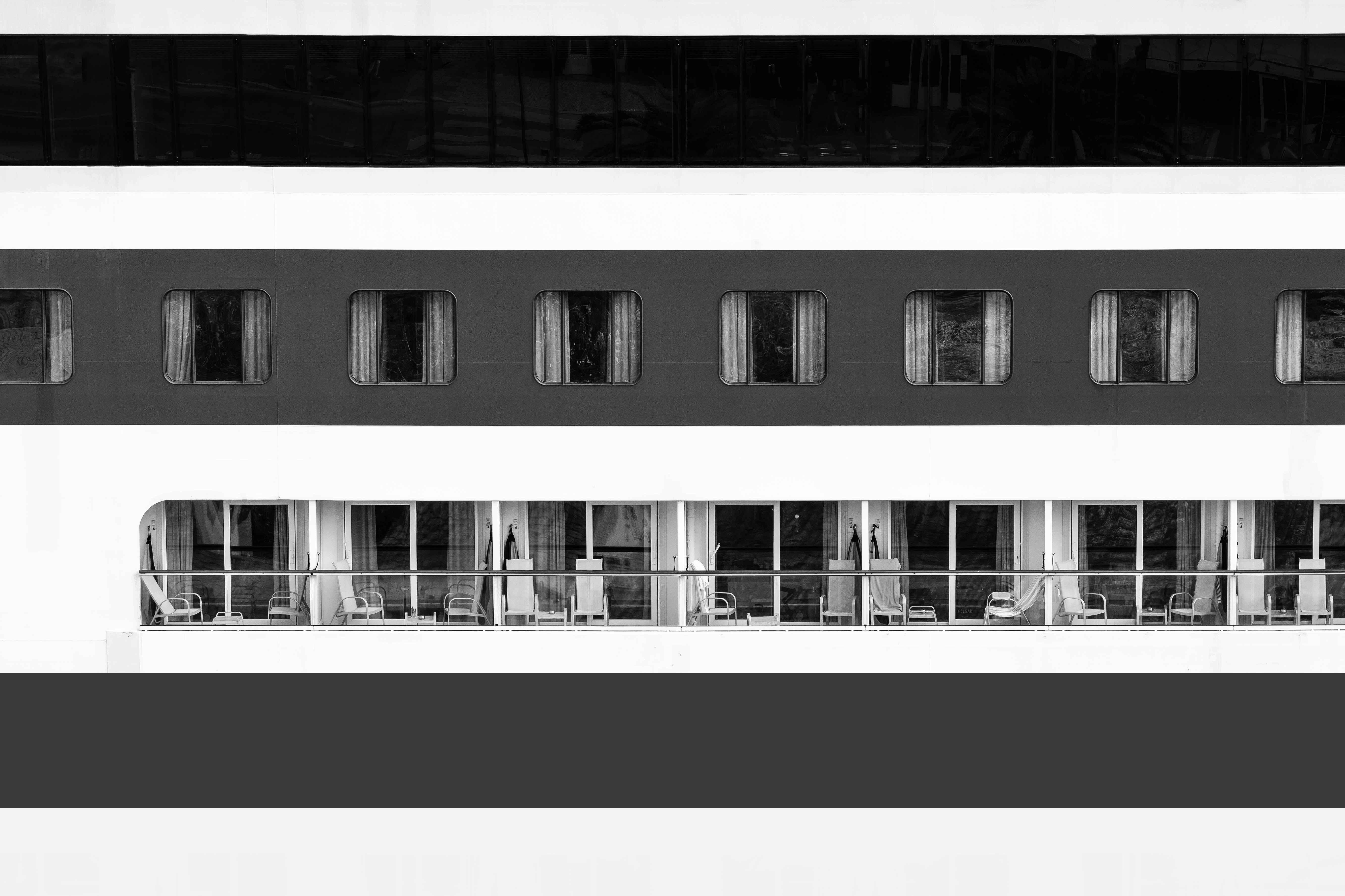 a black and white photo of a balcony on a cruise ship, Spotted parked up in Mahon, Menorca.