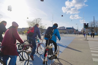 A bustling city street with modern urban mobility solutions like bike lanes and smart traffic lights.