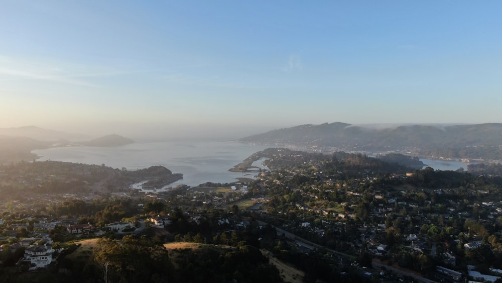 an aerial view of a city and a body of water