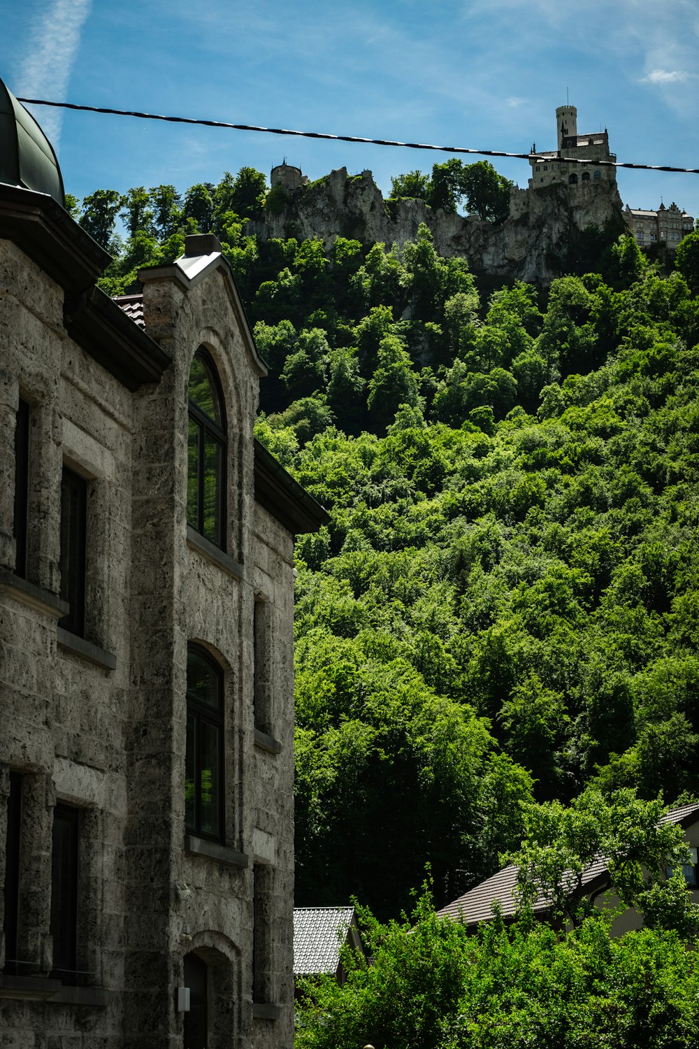 a stone building with a clock tower on top of it