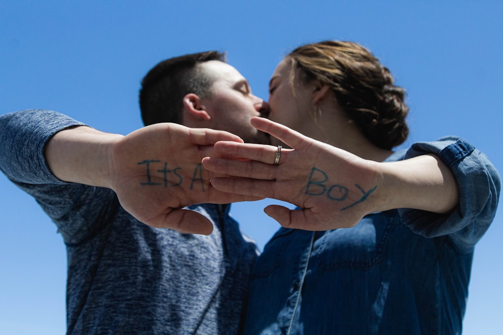 a man and a woman holding their hands together