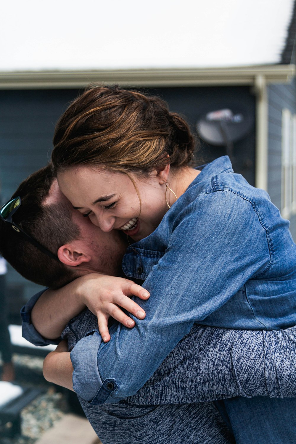 a man and a woman hugging each other