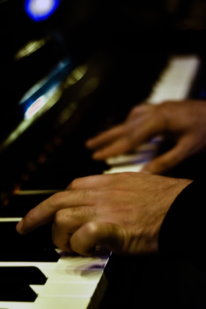 a person playing a piano with their hands