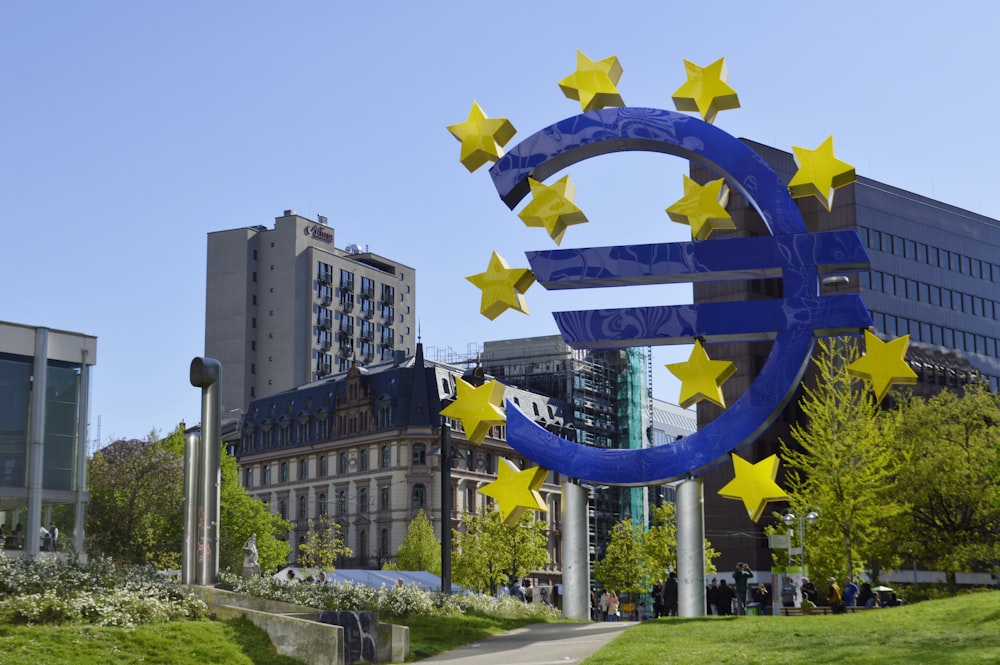 a large blue and yellow sign with stars on it