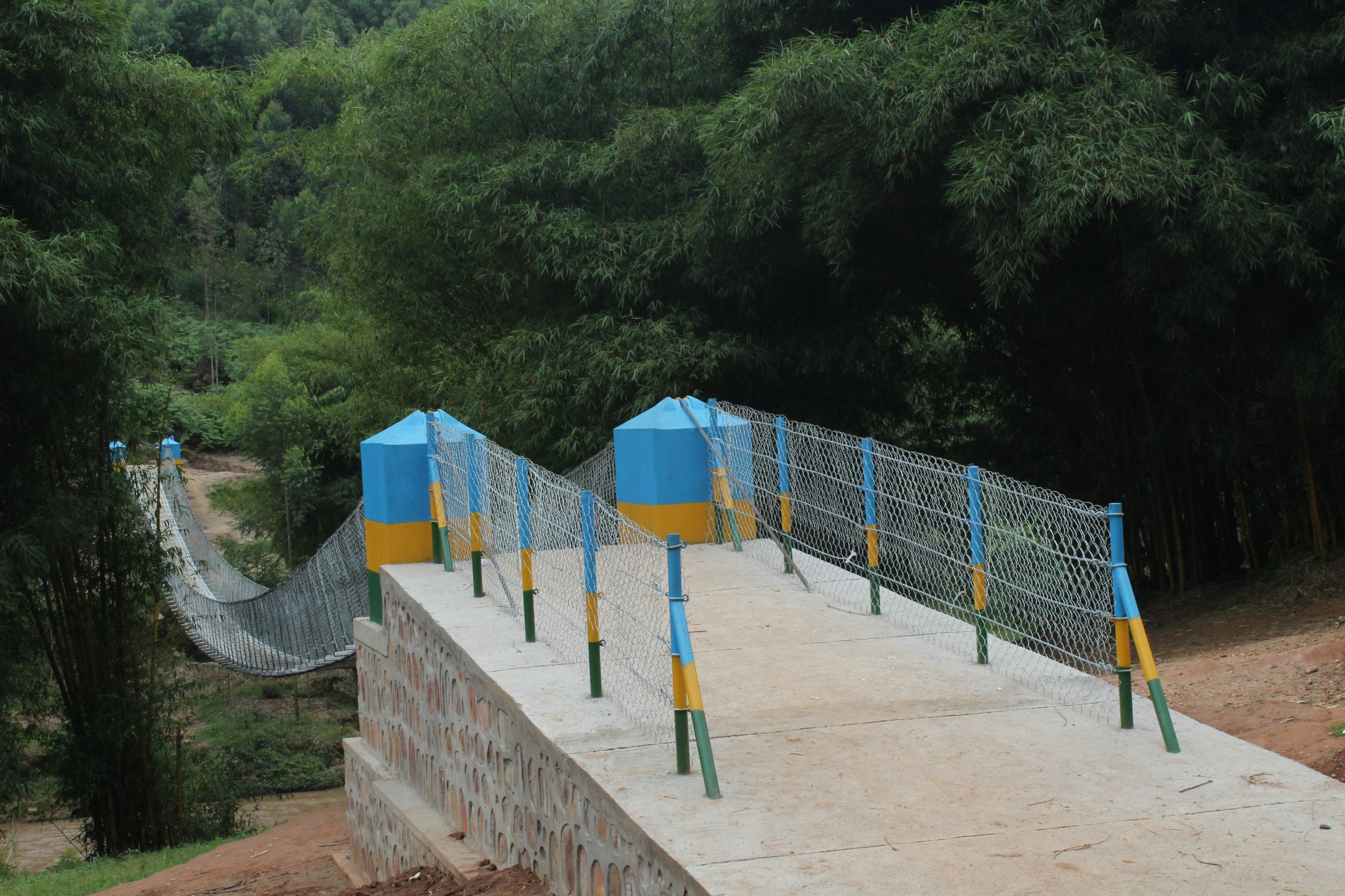 a bridge that has blue and yellow barriers on it