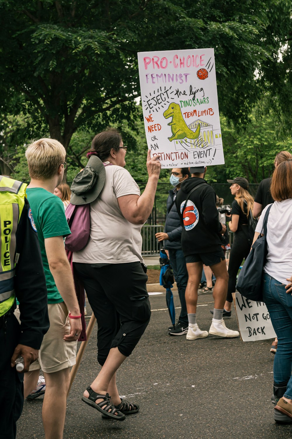 a group of people holding a sign