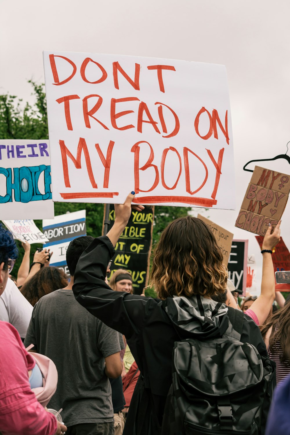 a group of people holding signs and protesting