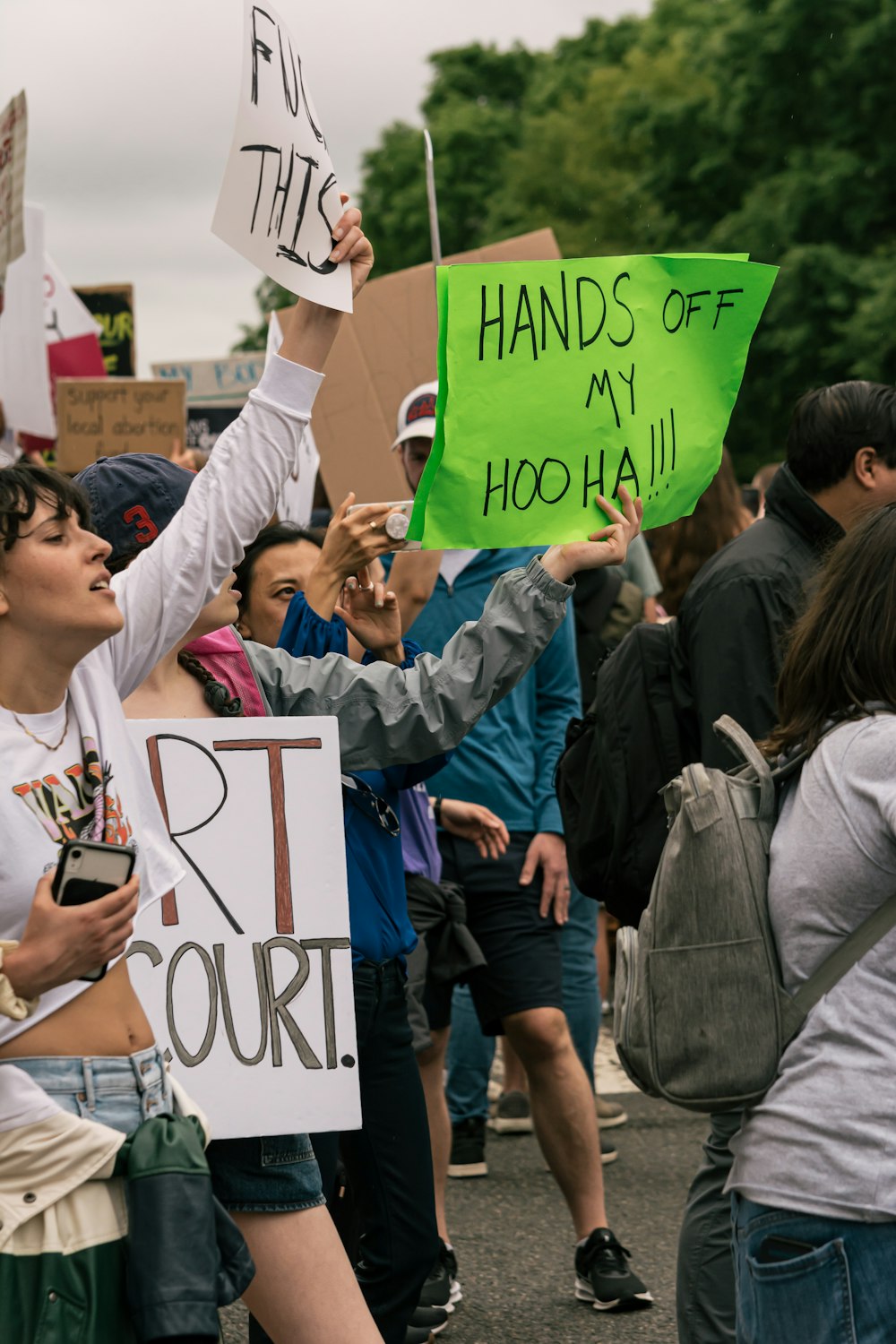 a group of people holding a sign