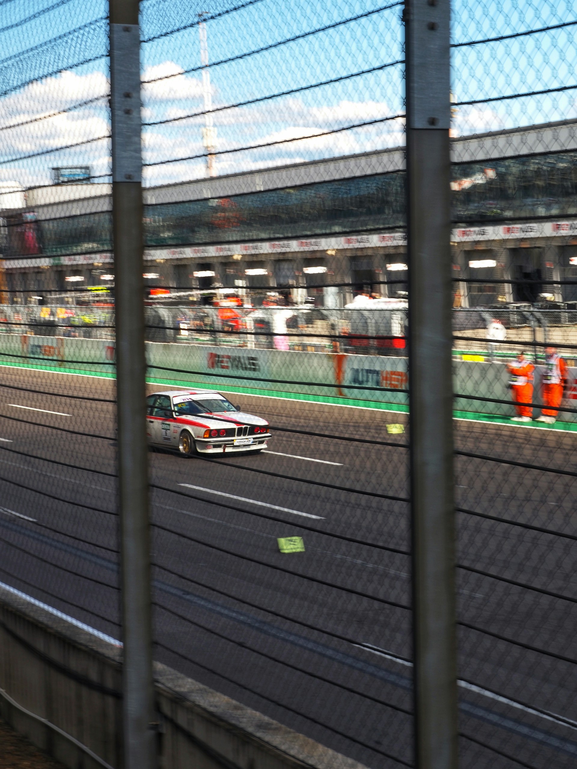 an abstract photo of a curved building with a blue sky in the background