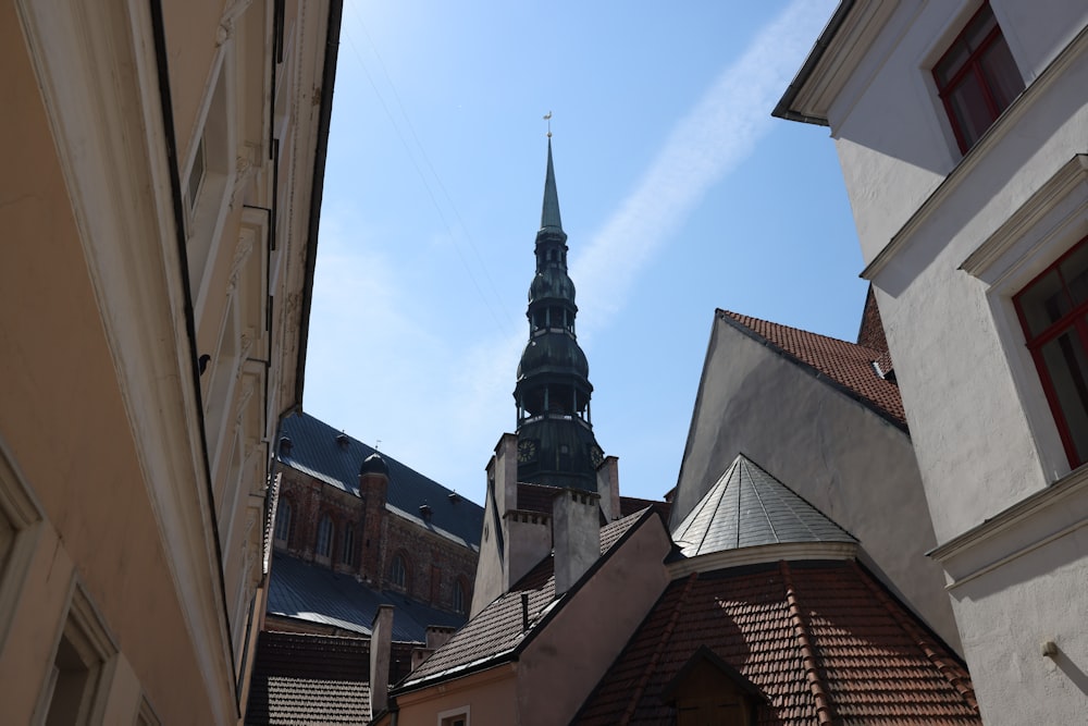 a steeple of a building with a clock on it