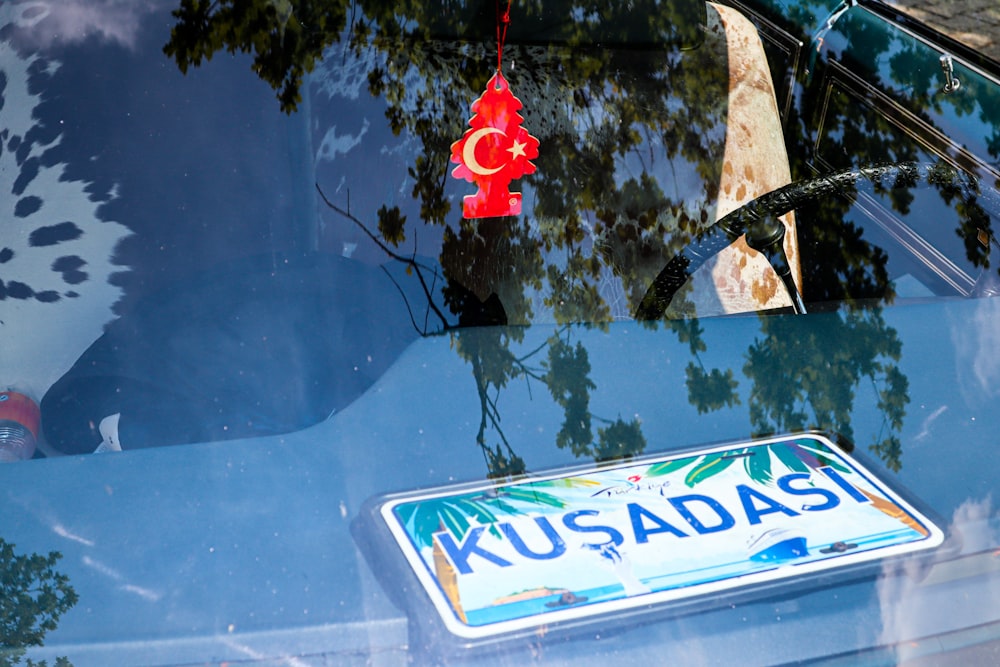 a close up of a car with a sign on it