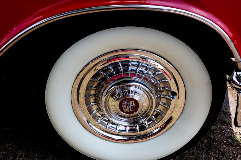 a close up of the spokes of a classic car