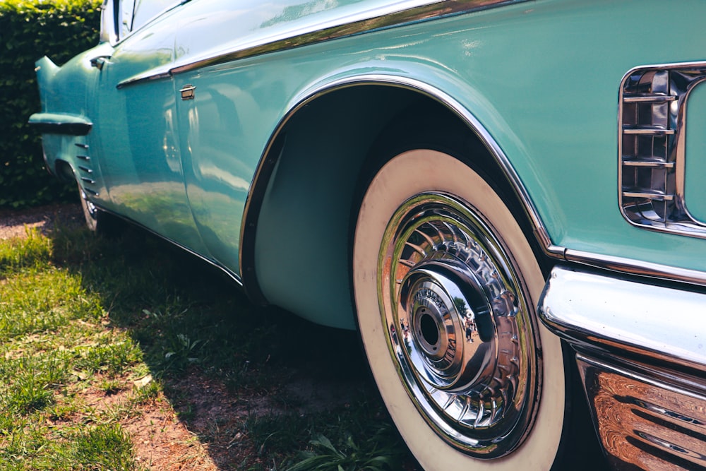 a close up of a car parked in the grass