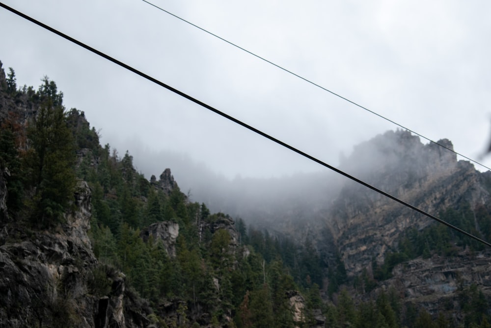 a view of a mountain with a power line in the foreground