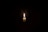 Subtle image of a lit candle with soft shadows, symbolizing respect and remembrance.