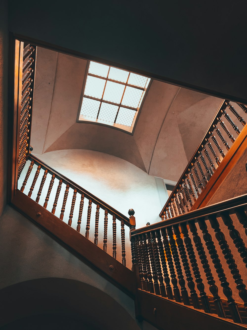 a person standing on a stair case in a building