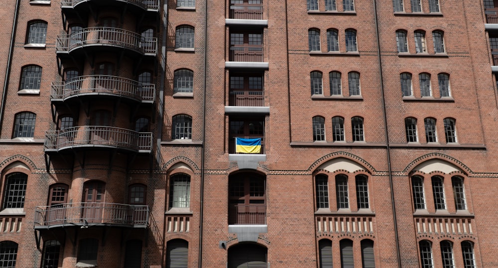 a tall brick building with balconies and balconies