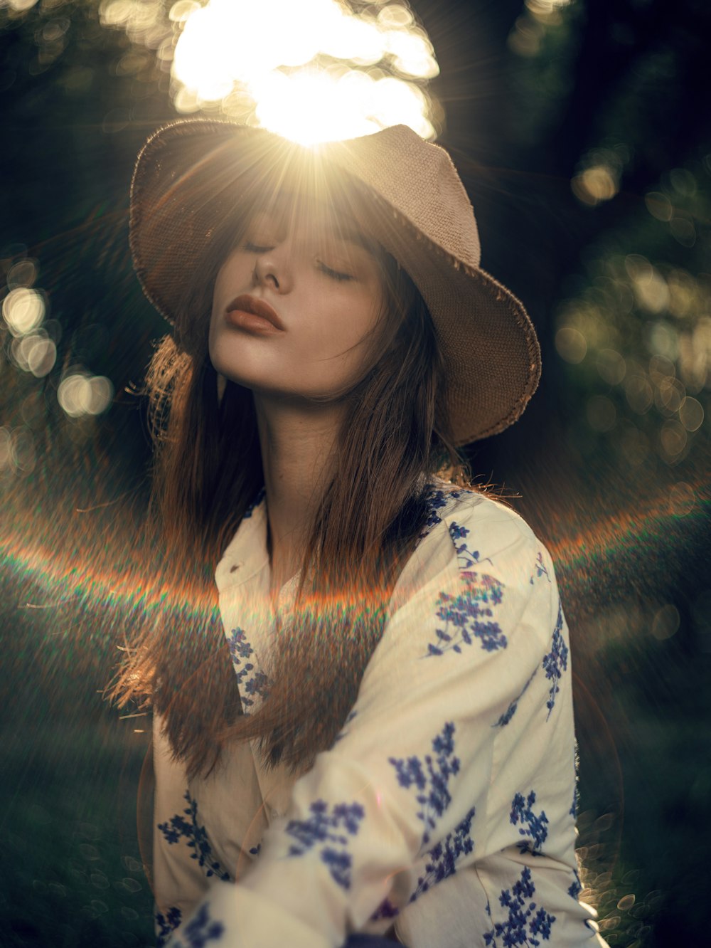 a woman in a hat is posing for a picture