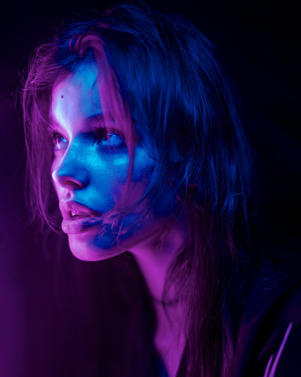 a woman with blue light on her face