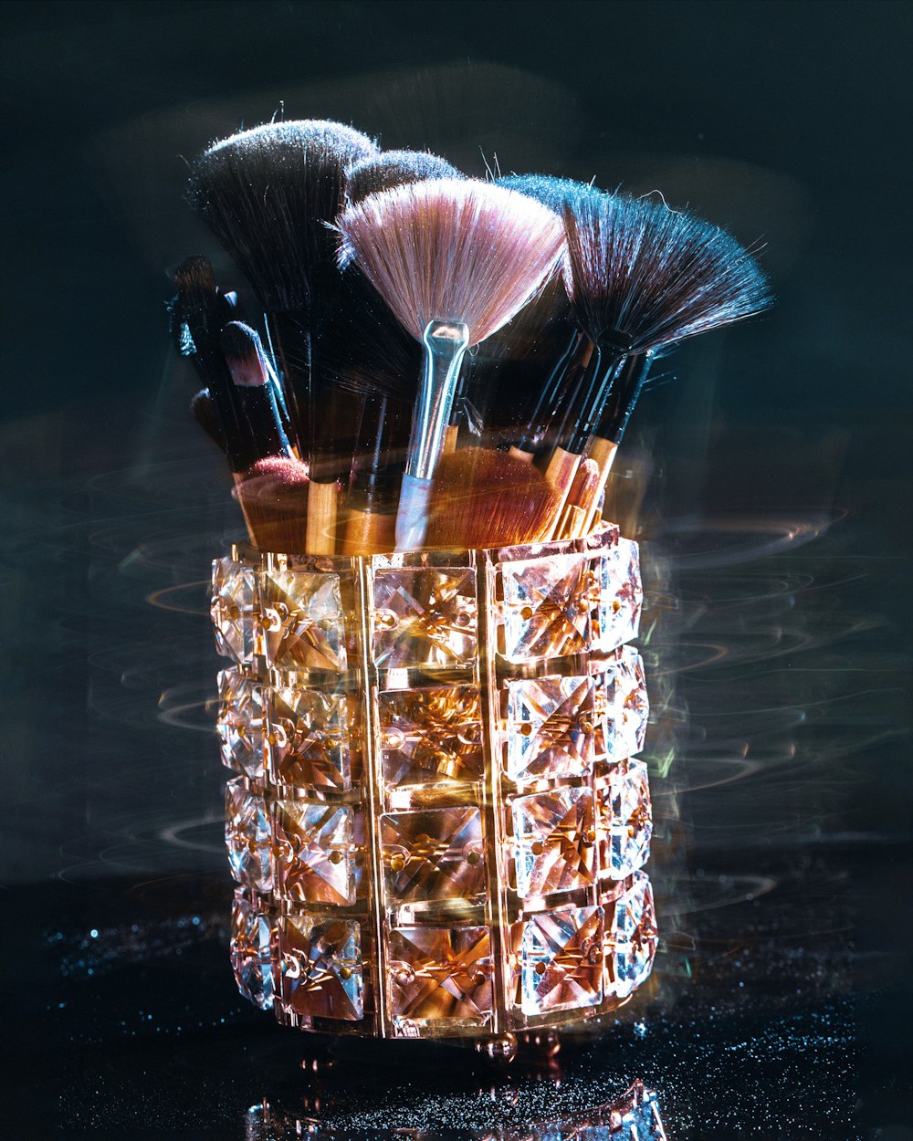 a close up of a brush holder with makeup brushes