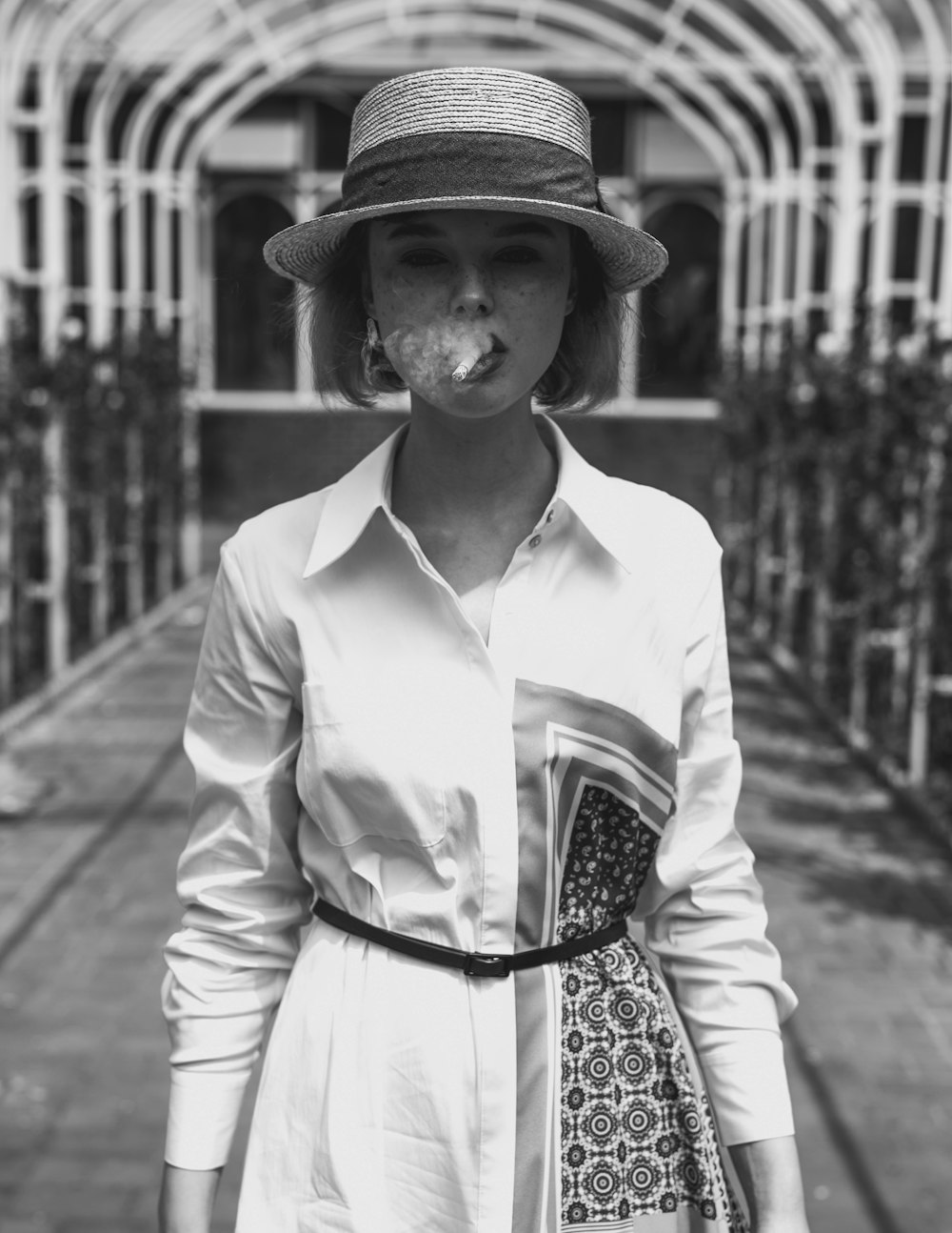 a woman with a cigarette in her mouth