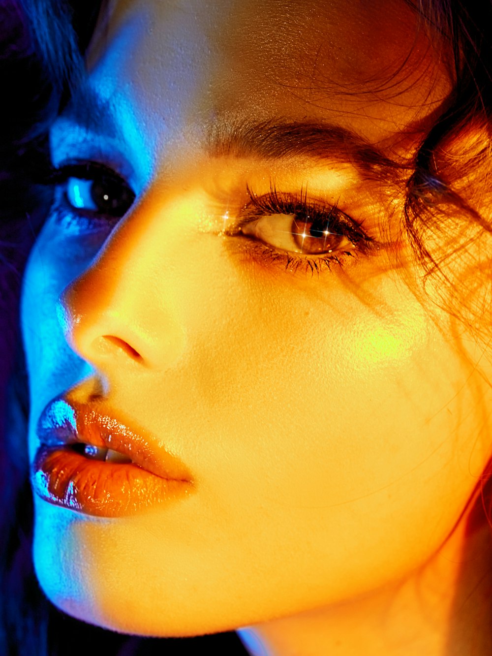 a close up of a woman's face with bright lighting